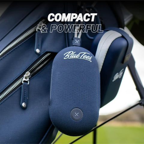 Player Go Golf GPS Speaker With AI Power, blue handheld device attached to golf bag, showing compact design and magnetic strip.