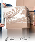 Two people using Heavy Duty Dark Blue Stretch Wrap With Built In Core Handles 20 By 1000 Feet Eighty Gauge to secure cardboard boxes.