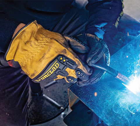 Person welding while wearing Mens 360 Degree Cut Resistant Level 5 Leather Work Glove with Impact Protection in Yellow XL