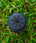 Top view of Heavy Duty Ground Stakes Torch Stand For Outdoor Tiki Torches on grass, featuring durable black polycarbonate material.