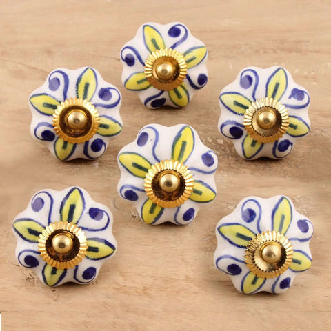Stunning Artisan Ceramic Cabinet Knobs Featuring Radiant Yellow Floral Blooms Set of Six Handcrafted Boho Kitchen Pulls With Glossy White Details displayed on wood.