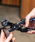 Person using Leather Hole Punch Kit With Easy Squeeze Lever Rotating Punch Wheel German Made Pro Grade Handheld Leather Tool For Precise Holes on a belt