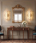 AooLiWang Gold LED Wall Sconces, Set of 2 with Transparent Glass Strip in elegant room setting with mirror and flowers.
