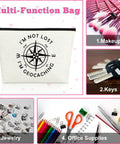 Im Not Lost Geocaching Gift Makeup Bag For Women Travel Essentials multifunctional use example with makeup, keys, jewelry, and office supplies.