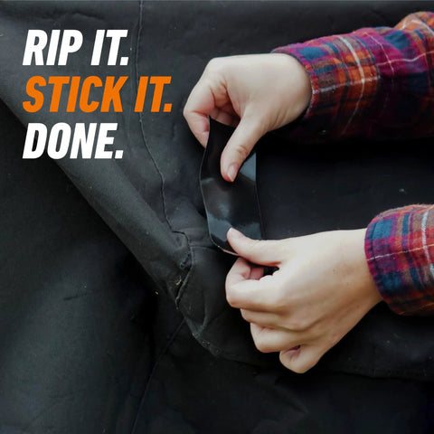 Hands applying All Weather Duct Tape For Outdoor Repairs Black 1.88 In By 25 Yd Heavy Duty Waterproof Tape on fabric.
