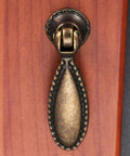 Two Pack Antique Bronze Single Hole Handle Pulls For Wooden Furniture Cabinets 60x18mm installed on wood surface