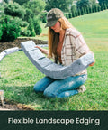 Person installing Landscape Edging Kit With Faux Stone Blocks For Lawn Borders And Flower Beds 10 Pack With 20 Spikes in yard