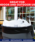 55 Gallon Heavy Duty Trash Bags With Ties Pack Of 50 for indoor outdoor use in a restaurant setting, full of disposable cups.
