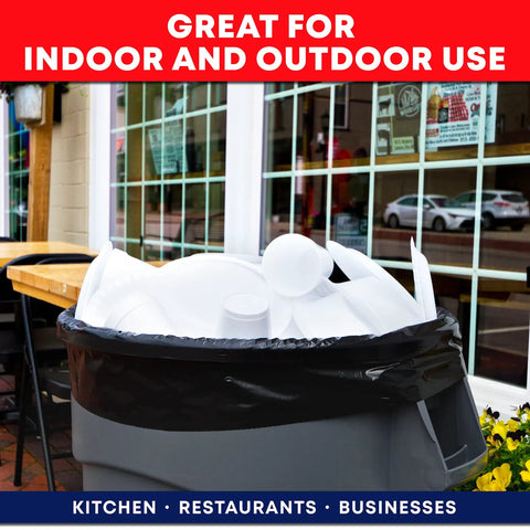 55 Gallon Heavy Duty Trash Bags With Ties Pack Of 50 for indoor outdoor use in a restaurant setting, full of disposable cups.