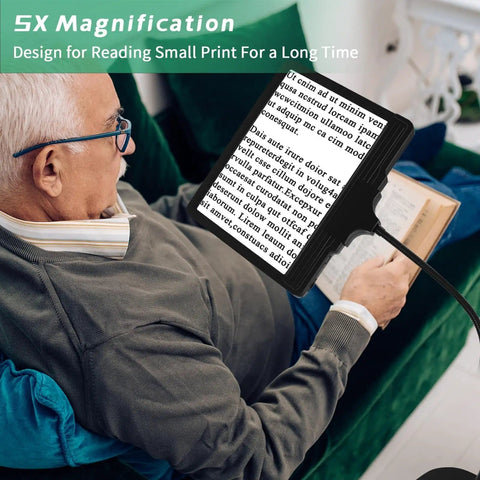 Senior man using All In One Floor Magnifier With Light 5X Rechargeable On Stand 43 LED Floor Magnifying Lamp for reading small print.