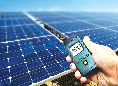 Hand holding Pocket Solar Power Meter For Solar Irradiance And Illuminance Measurement Handheld Light Meter For UV And PAR Readings Killer Tool