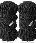 Soft Silk Bondage Rope Set 32 Feet Each 8mm Thick Two Pack For BDSM Shibari Play shown coiled in black with metal ends.