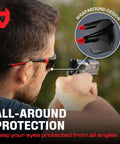 Person wearing Green Tinted Wraparound Safety Glasses With Adjustable Arms And No Slip Grips, UV 400 Protection, ANSI Z87.1 Rated.