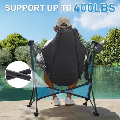 Person relaxing in Oversized Padded Hammock Camping Chair With Detachable Cup Holder Heavy Duty Swing Seat near a pond