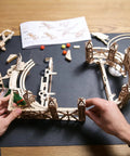 Hands assembling Harry Potter Quidditch Pinball Machine 3D Wooden Puzzle Kit For Adults To Build, Mechanical Model Craft
