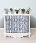 White drawer with Arrowhead Deep Peel And Stick Wallpaper In Blue For Totally Easy DIY Decor, removable geometric pattern.