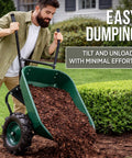 Man using Heavy Duty Dual Wheel Wheelbarrow Garden Cart With 500 Pound Capacity Extra Large Wheels And Built In Stand on grass