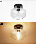 Heavy Duty Industrial Semi Flush Mount Ceiling Light With Tough Matte Black Frame And Authentic Seeded Glass Cover For A Big Time Modern Vintage Lighting Glow, off and on view.