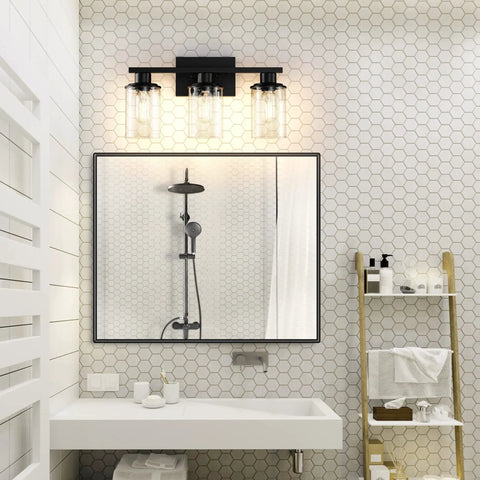 Dope Black Bathroom Vanity Light Fixtures Over Mirror 3-Light Wall Sconce With Clear Glass Shades in modern bathroom setting.