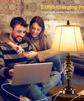 Couple using laptop near Farmhouse Table Lamp Set Of 2 With 3 Way Dimming Vintage Bedside Lamps With USB Ports And Included LED Bulbs