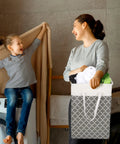 Mother and child doing laundry with Six Pack 75L Large Collapsible Laundry Baskets With Reinforced Handles in gray pattern.