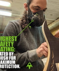 Person wearing Half Face Respirator With Replaceable Twin Filters For Dust Protection, 99.99 Percent Filtration in woodworking.