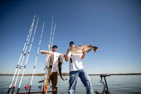 7 Foot Catfish Spinning Rod Two Piece For Heavy Duty Catfishing, 15 To 30 Pound Line Rating, Medium Heavy Power, fishermen holding catfish