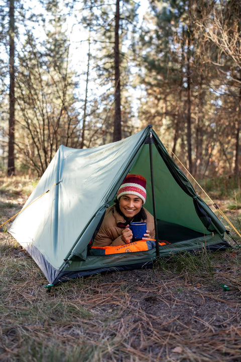 Person inside Forest Scout Backpack Tent for Quick Camp Setup Lightweight Frame Shelter With 1000mm PU Coated Polyester