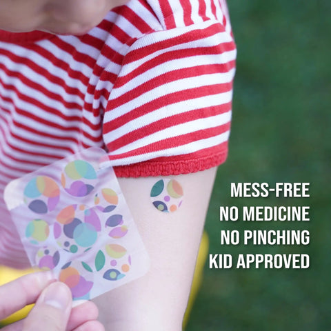 Child's arm wearing Mosquito Bite Relief Patch For Kids With Aloe And Witch Hazel Fast Itch Relief Hydrocolloid Insect Bite Treatment.
