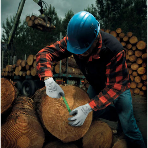 Worker wearing Insulated Latex Coated Work Gloves With Rough Grip For Winter Construction And Outdoor Tasks, Gray, Medium, 12 Pack, measuring log in lumberyard.