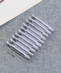Heavy Duty Furniture Cam Lock Fittings And Bolt Dowels Kit shows metal bolt dowels on fabric, 16 in total, for flush surfaces.