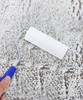 Heavy Duty Paint Roller Covers With Frame for Crisp Wall And Edge Painting Smooth Operator Handle Grip Easy Control Tool for DIY Projects in use on a painted surface.