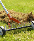 Wheeled Dethatching Rake For Lawn With 15 Inch Heavy Duty Stainless Steel Head, Adjustable Long Handle 35 To 67 Inches in use on grass