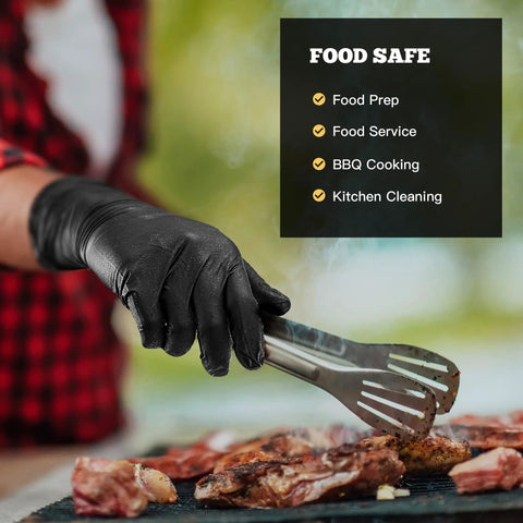 TitanFlex black nitrile gloves, 6-mil textured; worn by hand using metal tongs over grilled meat.