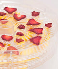 Premium Electric Food Dehydrator Packing Five BPA Free Trays For Backyard Jerky Dried Fruits And Fresh Herbs with sliced strawberries.
