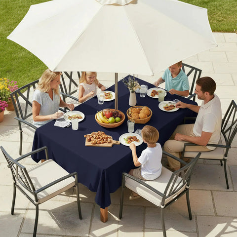 Family dining outdoors with outdoor table cover with umbrella hole and zipper 60x84 inch navy low maintenance washable waterproof tablecloth.