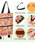 Floral folding shopping bag with wheels, showing sturdy carry handle, waterproof fabric, and foldable design for travel and shopping.