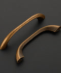 10 Pack Antique Brass Cabinet Pulls With Ergonomic Curved Grip For 5 Inch Kitchen Cabinets And Drawers Modern Layered Detailing