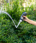 MicroJet MJ 450 Portable Bidet And Peri Bottle Sprayer For Travel demonstrating precise water jet outdoors