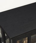Close-up of black top surface of 30 Inch Glass Curio Display Cabinet With LED Lighting Modern Two Lattice Doors.