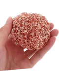 Hand holding a copper wire sponge ball, part of Six Pack Soldering Tip Copper Wire Sponge Balls For Efficient Tin Removal And Clean Tip.