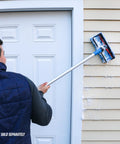 User cleaning siding with 10 Inch Bi Level Soft Wash Brush Drops Onto Water Flow Poles Easily, dual tier bristles removing dirt.