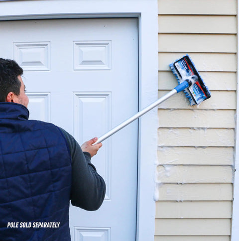 User cleaning siding with 10 Inch Bi Level Soft Wash Brush Drops Onto Water Flow Poles Easily, dual tier bristles removing dirt.