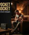 Person playing guitar with 10W Wireless Portable Guitar Amp With Type C Rechargeable Battery in cozy living room scene.