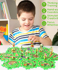 Child playing with Puzzle Racer Car Track Set For Kids Ages 3 To 8 With 10 Puzzle Tracks Snail Car And Road Sign Pieces on table