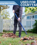 Person using Rugged 14 Tine Metal Garden Rake With 57 Inch Fiberglass Handle Anti Rust Coating Heavy Duty Lawn And Soil Leveling Tool