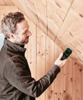 Man using Wood Moisture Meter With Pin Probes, Fast Reading For DIYers And Pros, Two Wood Groups For Precise Moisture on ceiling