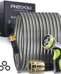 Stainless steel 50ft metal garden hose with brass fittings and 10-function spray nozzle, coiled beside a box.