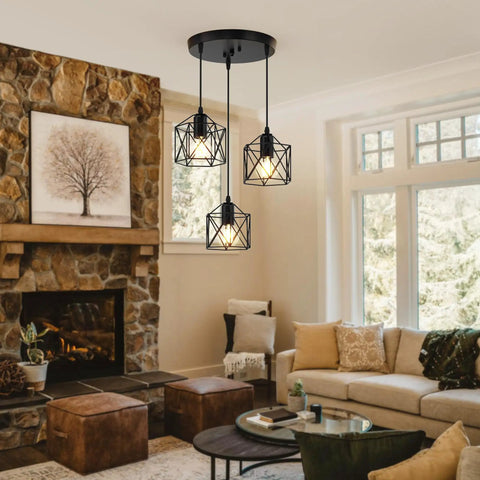 Slick Farmhouse Three Light Pendant With Adjustable Drop Cords Matte Black Hanging Ceiling Lamp above cozy living room setting.