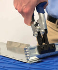 Person using Straight Sheet Metal Seamer Set with 3 in forged blade on metal sheet, interchangeable handles for versatile bending